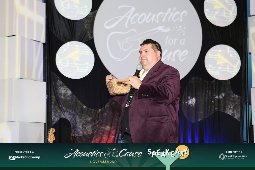 a presenter holding a basket and microphone